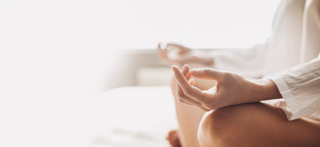 Serene meditation: Woman with crossed legs and calm hand positioning